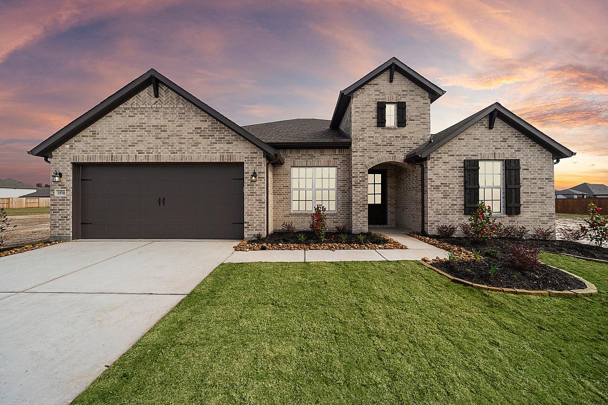 Caldwell Homes Model Home Exterior Dark Brown Garage Door